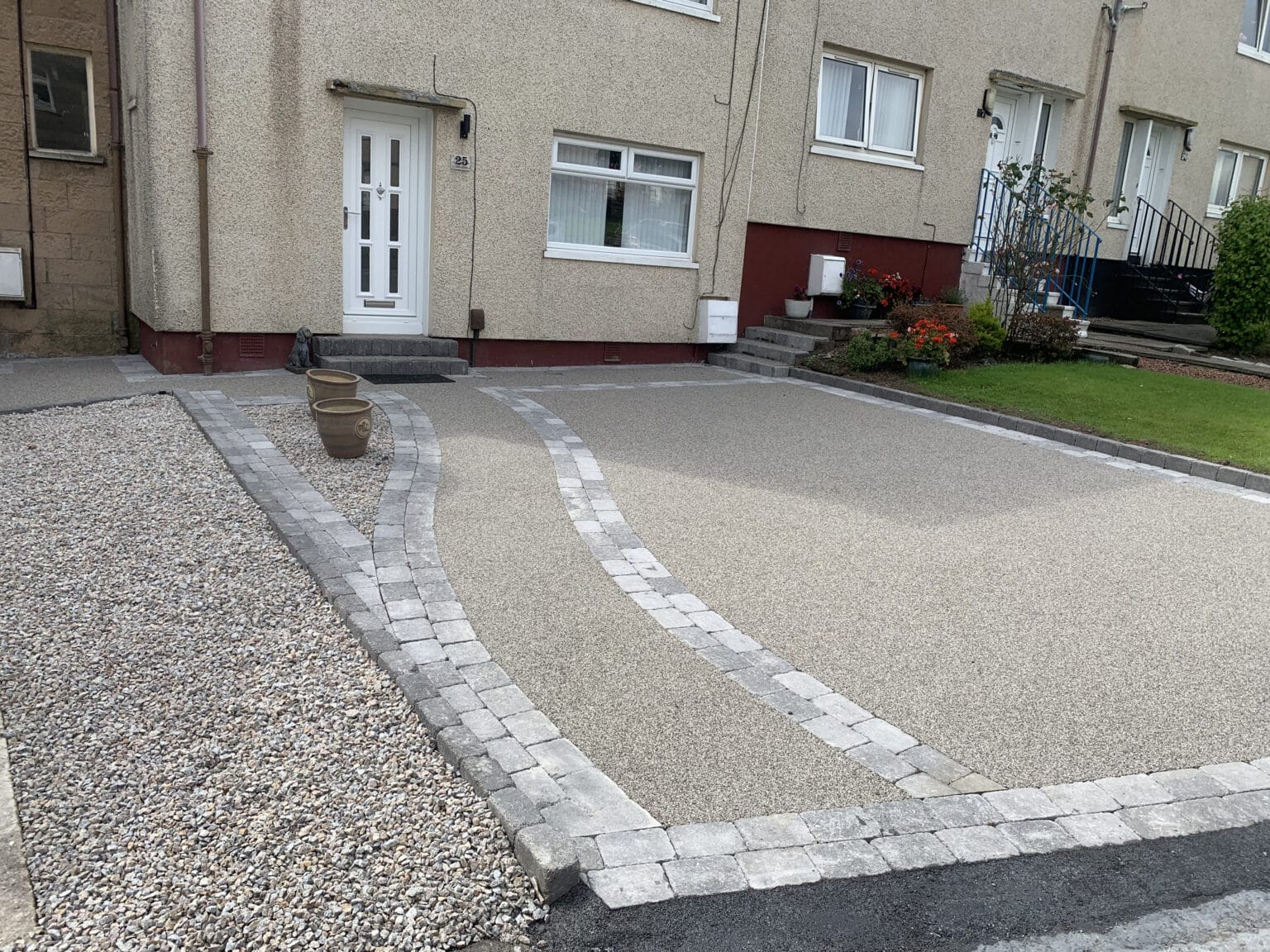 Driveway at front of house complete with resin
